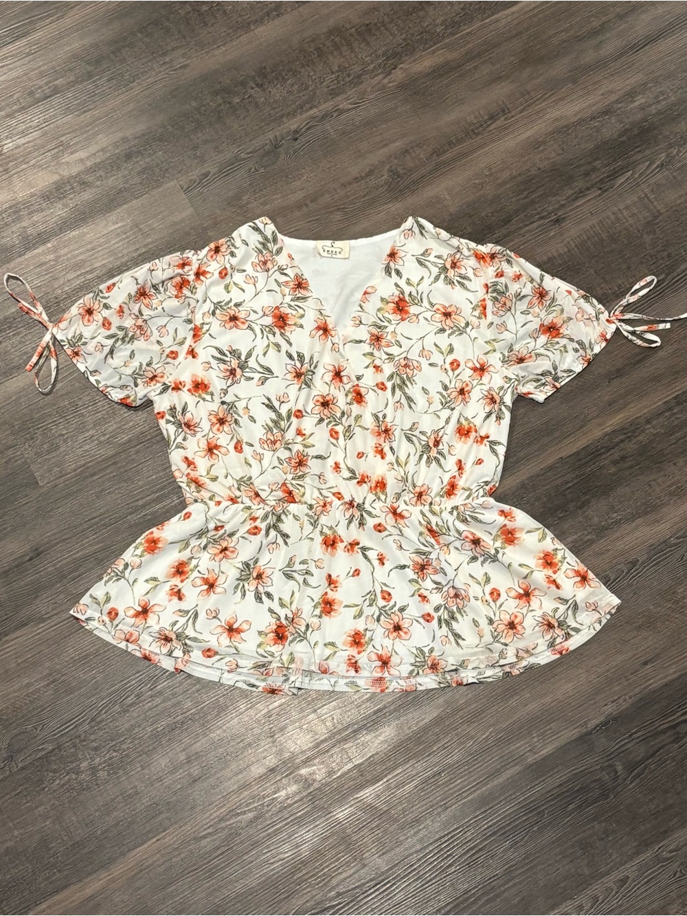 Floral V-Neck Peplum Blouse in White with Orange Floral Print